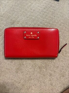 kate spade red zip-around leather wallet with gold logo